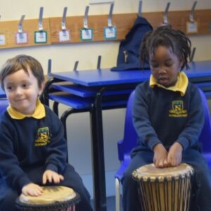 Students banging the drums
