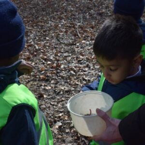Student looking into a bucket