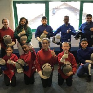 children in fencing gear