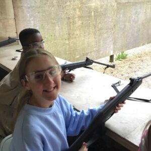 students holding guns