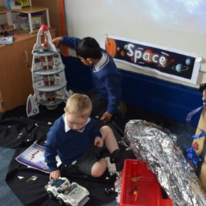 children working with space supplies