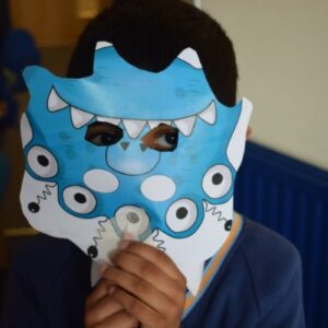 child with a blue mask over his face