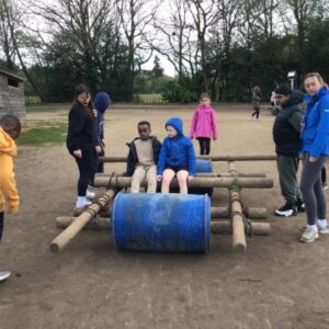 students building a wooden raft