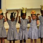 Students dancing with animals on their heads