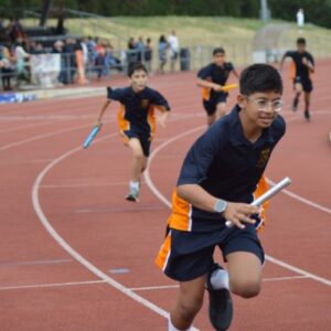 Student running with a baton