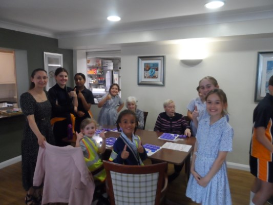 Students in the dining room with Bingo players