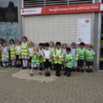 children in high-vis jackets