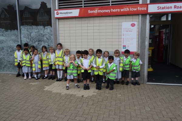 children in high-vis jackets