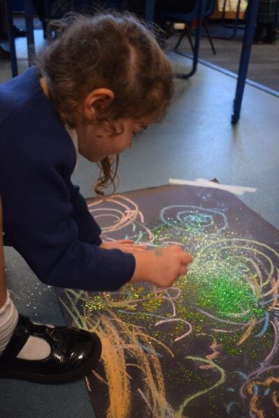 girl sprinkling glitter