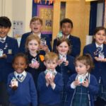 students holding mini easter boxes