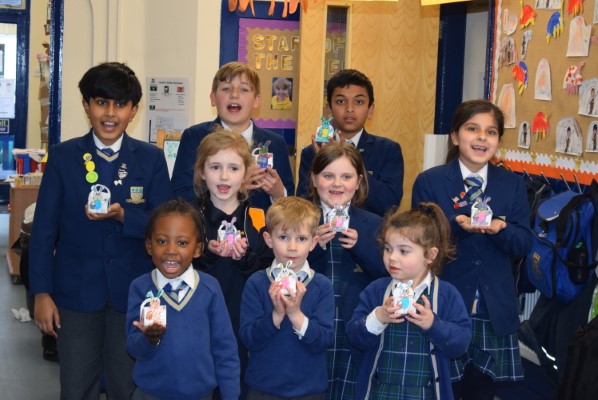 students holding mini easter boxes