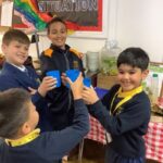 students holding cups