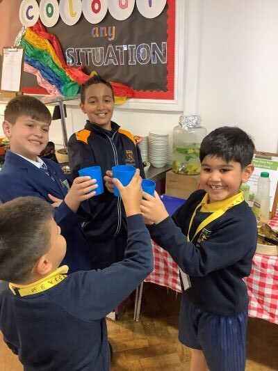 students holding cups