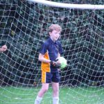 boy in a goal post