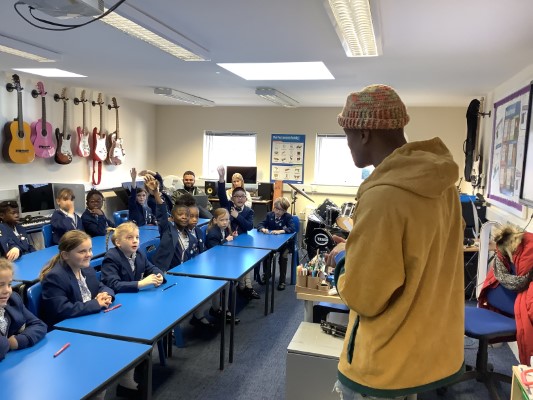 students listening to a man