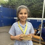 girl holding a bowl of food