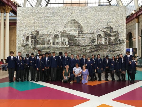 students in front of a big picture
